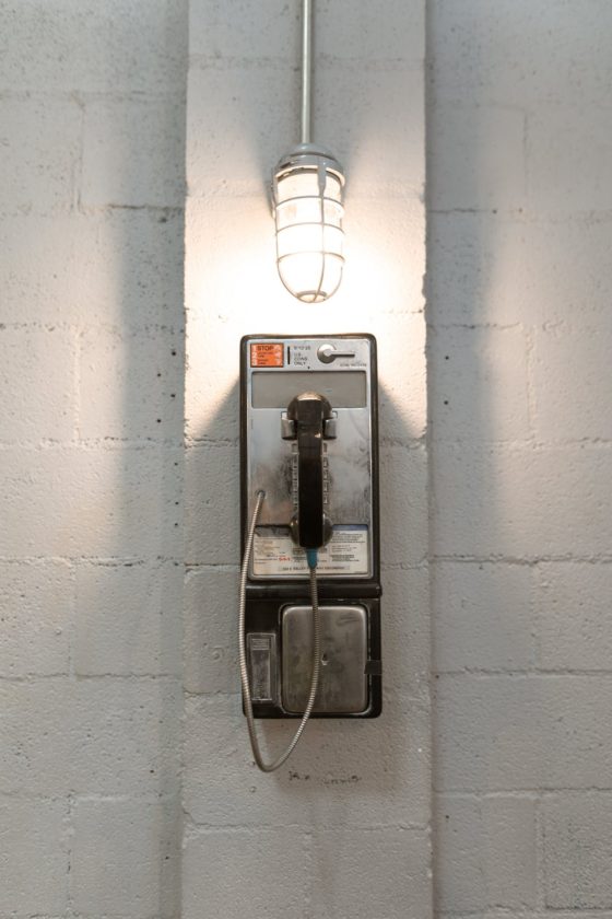 Picture of a payphone in a prison. 